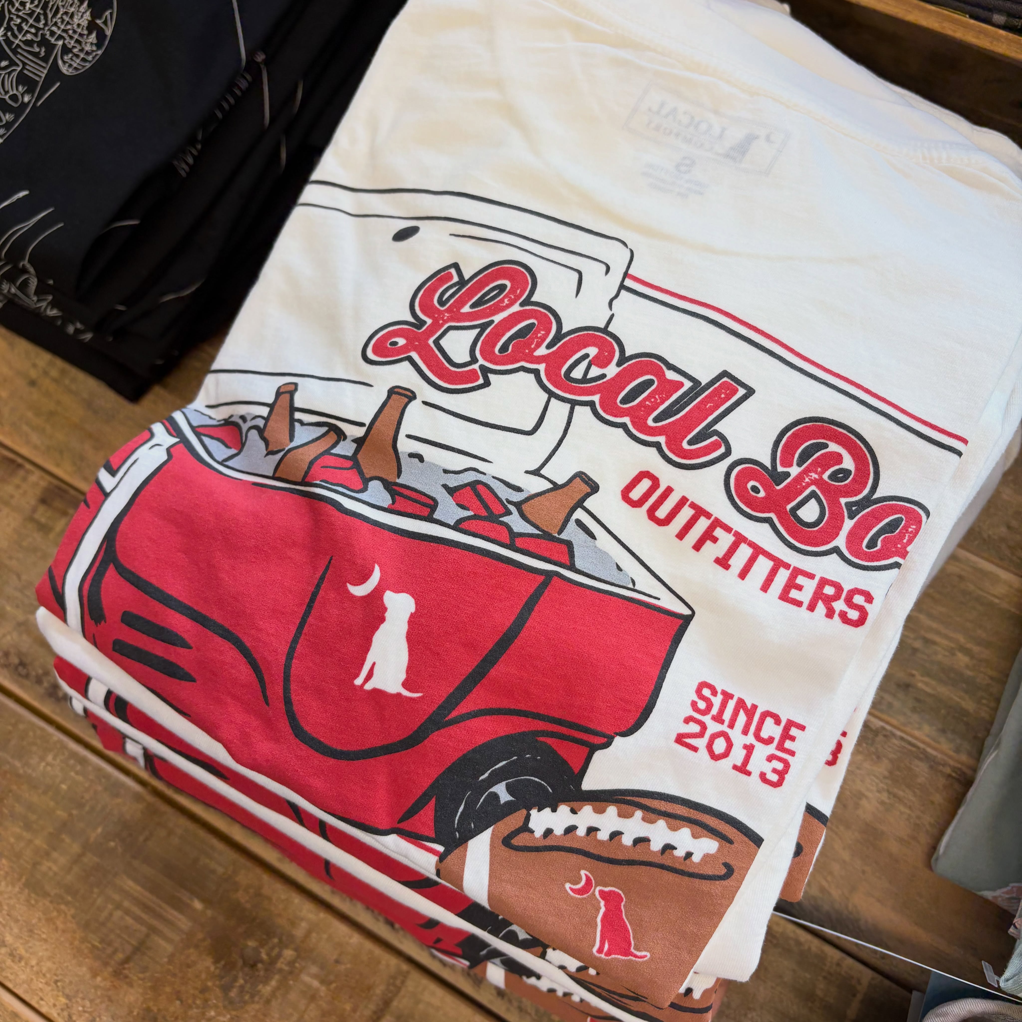 Local Boy Outfitters tailgate and football graphic shirt for back-to-school shopping at Reeves Clayton
